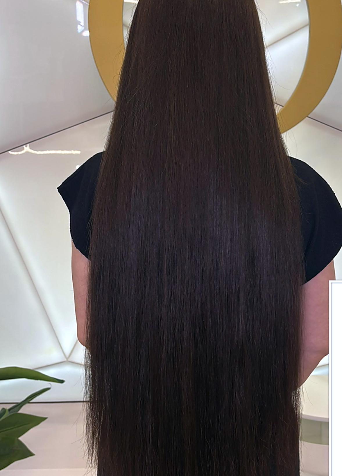 Long brunette hair extensions fitted at PhiStudio Dubai